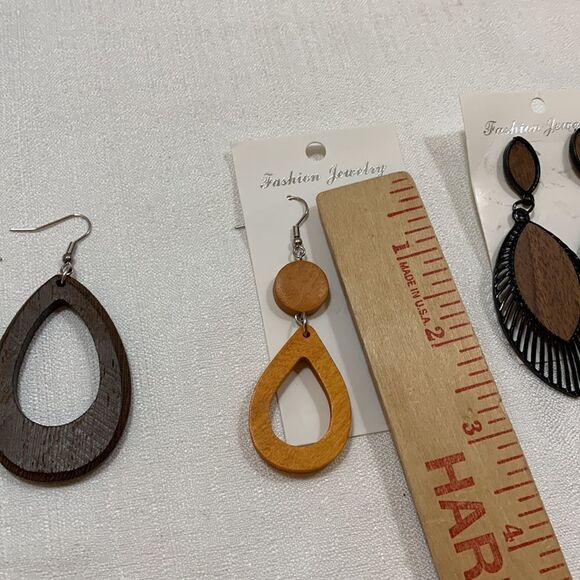 Four pair of earrings. Two are solid wood & walnut color have metal trim detail - Picture 10 of 11